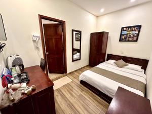 Giường trong phòng chung tại Nam Xuan Premium Hotel