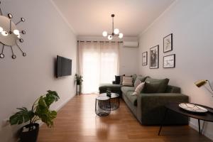 a living room with a couch and a table at Modern Apartment in Exarchia in Athens