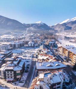 an aerial view of a city with snow covered buildings at Luxury studio in Bansko