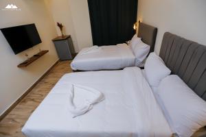 Rúm í herbergi á Sofia Pyramids Hotel
