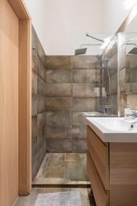 a bathroom with a sink and a mirror at Deluxe Downtown Home by Elisabeth in Budapest +16 photos