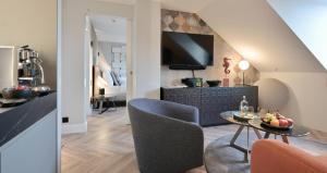 Televiisor ja/või meelelahutuskeskus majutusasutuses Boutique Hotel Wellenberg