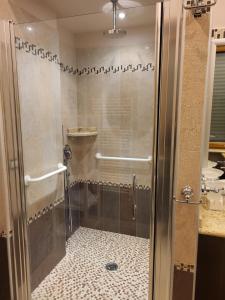 a shower with a glass door in a bathroom at La torre in Velletri