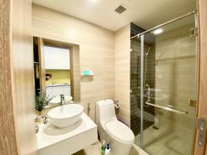 a bathroom with a toilet and a sink and a shower at Yu Stay Apartment in Soho D1 near Bui Vien walking street in Ho Chi Minh City +30 photos