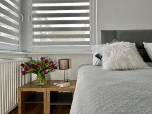 Posteľ alebo postele v izbe v ubytovaní Apartament Cobena