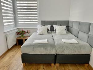 Posteľ alebo postele v izbe v ubytovaní Apartament Cobena