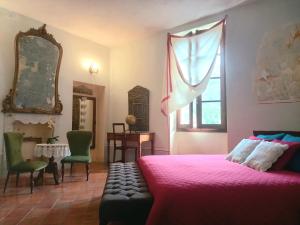Łóżko lub łóżka w pokoju w obiekcie La Casa Rosa