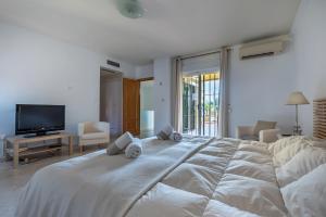 Uma cama ou camas num quarto em Apartamento Dúplex Los Cartujanos I