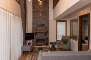 TV a/nebo společenská místnost v ubytování Abant Cozy Homes