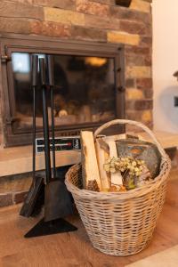 a basket of breads in front of a fireplace at Abant Cozy Homes in Bolu