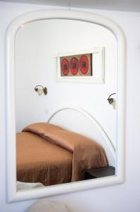 Un pat sau paturi într-o cameră la B&B dai Carari