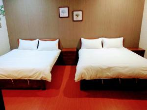 Postel nebo postele na pokoji v ubytování Ju Jia Xiao Zhan Homestay