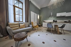 a living room with a couch and a table at Clos Grimont in Poligny