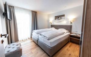 Postel nebo postele na pokoji v ubytování Appartements Eldorado