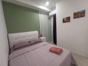 Postel nebo postele na pokoji v ubytování Kuching Metrocity Homestay-S01 Wincy