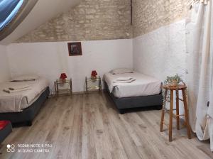 Postel nebo postele na pokoji v ubytování La Longère de Thoré