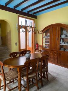 a dining room with a wooden table and chairs at Ca Elvireta in Benissa +43 photos