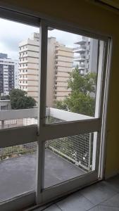 an open window with a view of a city at SANFER in San Fernando