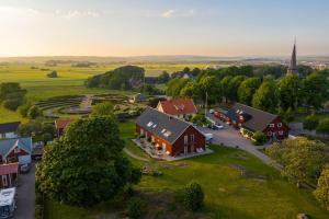 an aerial view of a small village with a red house at Halmstad Gårdshotell in Halmstad