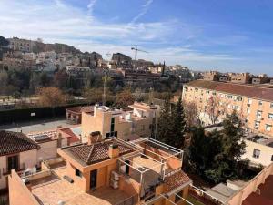 an aerial view of a city with buildings at Apartamento en Granada in Granada