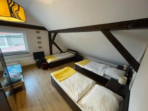 A bed or beds in a room at Gospodarstwo Agroturystyczne u Wojciecha