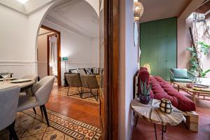 a living room with a couch and a table at Habitat Apartments Grace in Barcelona