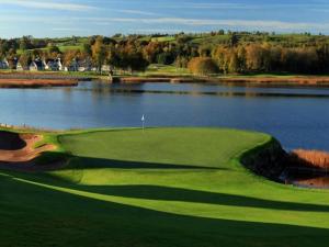 a golf course next to a body of water at Derryree House in Lisnaskea