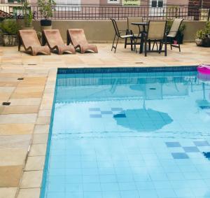 Bazén v ubytování Hotel de Minas nebo v jeho okolí