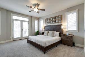 a bedroom with a bed and a ceiling fan at Stunning Nashville Condo Minutes from Broadway in Nashville