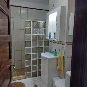 a bathroom with a sink and a toilet and a mirror at Victoria Court 2, Los Cristianos in El Guincho