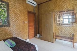 Postel nebo postele na pokoji v ubytování Ubud Kerta City Hotel