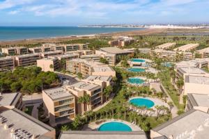 an aerial view of the resort with the ocean in the background at Salgados Beach House 2-Bedroom & 7 Pools in Guia