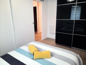 Posteľ alebo postele v izbe v ubytovaní Ty Cocoon- Appartement avec terrasse et parking privé