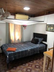 a bedroom with a bed in a room at Yi family Homestay in Siem Reap