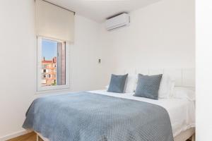 Llit o llits en una habitació de Idyllic apartment in BCN beach