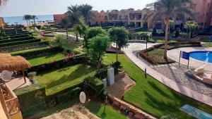 an aerial view of the gardens and swimming pool at a resort at Mountain View 2 Ain Sokhna, Sea & Pool View, Penthouse with Roof- Families ONLY in Ain Sokhna