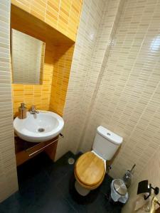 a bathroom with a toilet and a sink at Casa da Joana by Portus Alacer in Portalegre +30 photos