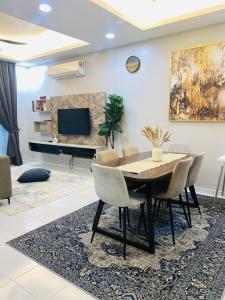 a dining room with a table and chairs at Haira Muslim Homestay in Pasir Gudang