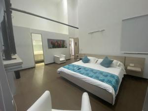 Ένα ή περισσότερα κρεβάτια σε δωμάτιο στο BGA Hotel