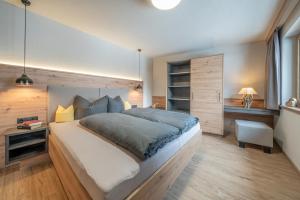 Posteľ alebo postele v izbe v ubytovaní Bergmomente Apartments