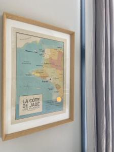 a picture of a map hanging on a wall at La Suite du Héron nantais in Nantes
