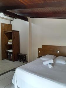 Ein Bett oder Betten in einem Zimmer der Unterkunft Hotel D'Luz