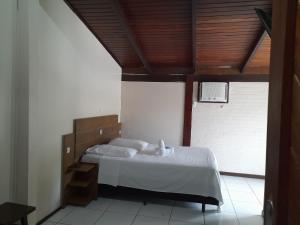 Ein Bett oder Betten in einem Zimmer der Unterkunft Hotel D'Luz