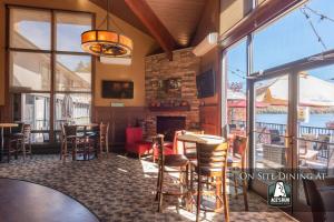 a restaurant with a fireplace and tables and chairs at 105A Efficiency One Bath in Oakland