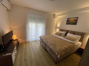 מיטה או מיטות בחדר ב-M Apartments