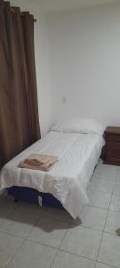 Een bed of bedden in een kamer bij Departamento Maipu centro