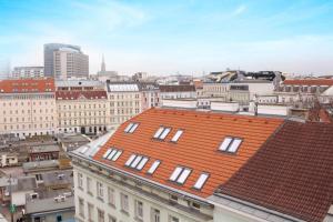 a view of a city with a red roof at OrestaLiving - View of Vienna in Vienna