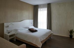 A bed or beds in a room at Foresteria La Torretta