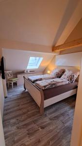 a bedroom with a bed and a skylight at Ferienwohnung Sternenstube in Völkenroth