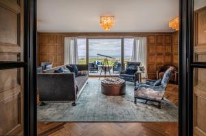 a living room with a couch and chairs at Old Course Hotel St Andrews in St. Andrews